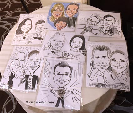 assortment of caricatures on a table drawn during a bat mitzvah Characatures by Marty